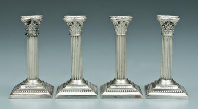 Four sterling candlesticks: Corinthian