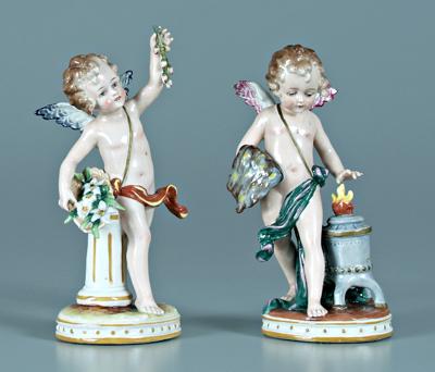 Pair porcelain cupid figurines: