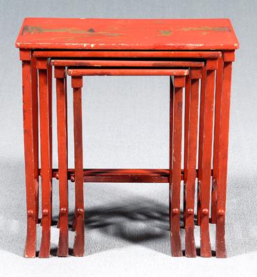 Nest of four red lacquer tables: