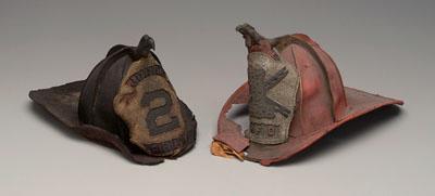 Two 19th century fire helmets: both
