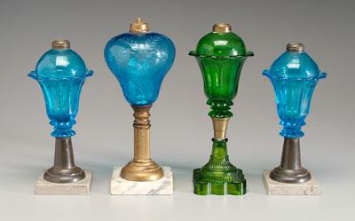 Four fluid lamps: tallest with blue