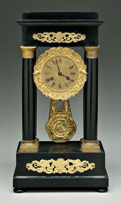 Empire portico clock, ebonized wood