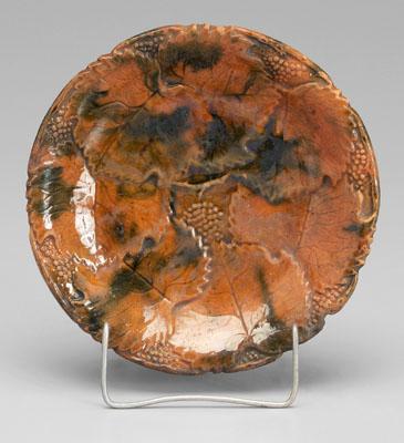 Grape-decorated redware shallow