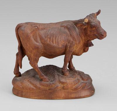 Well-carved standing cow with bell,