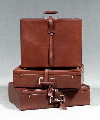 Three Cross leather suitcases: