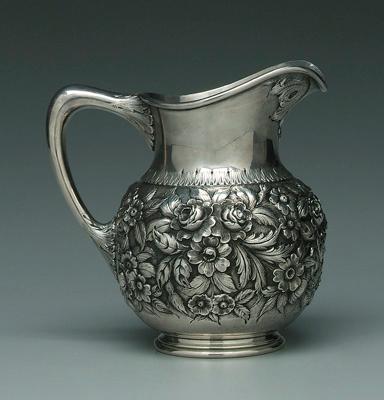Repoussé sterling water pitcher, round
