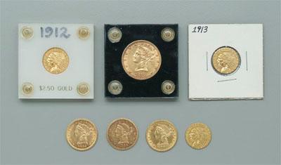Seven U.S. gold coins: one $10