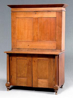 Walnut drop-front desk on cabinet,