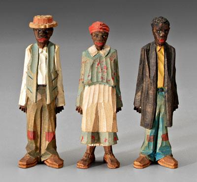 Three painted wood carvings: chip carved