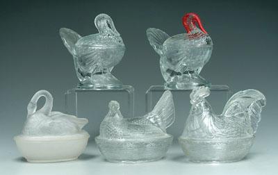 Five covered dishes with birds: