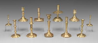 Eleven brass candlesticks includes 93be3