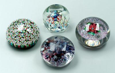 Four paperweights: one closely