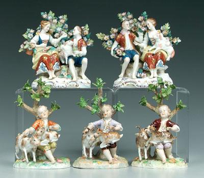 Five figurines: three of boys with
