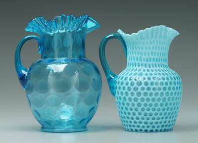 Two blue glass pitchers: one clear thumbprint