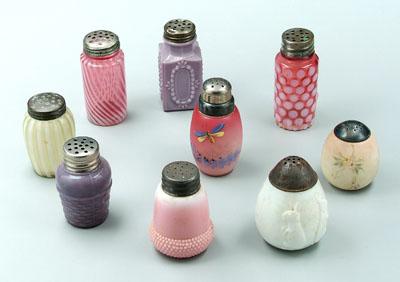 Nine small glass shakers: one cranberry