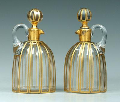 Two glass cruets: shaped as hooped