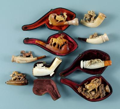 Nine Meerschaum pipes: carved figures,