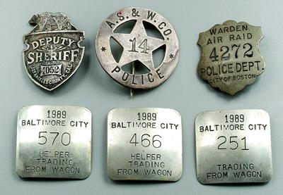 Six badges: three Baltimore City,