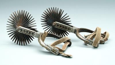 Pair decorated brass and steel spurs: