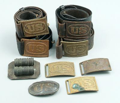 Eight brass U.S. belt buckles: