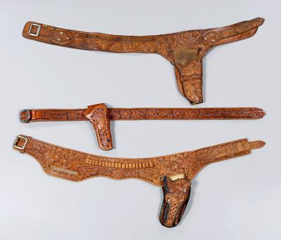 Three tooled leather belts, holsters: