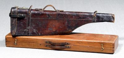 Two gun cases: one leather with