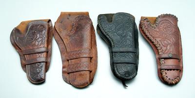 Four Colt revolver holsters: all tooled