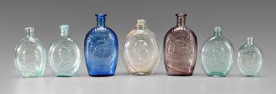 Seven Washington portrait flasks,