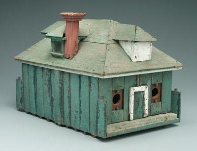Painted wooden birdhouse, nailed