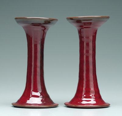 Two red glazed candlesticks Seagrove 949ce