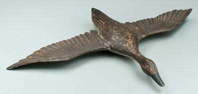 Carved and painted duck in flight, old