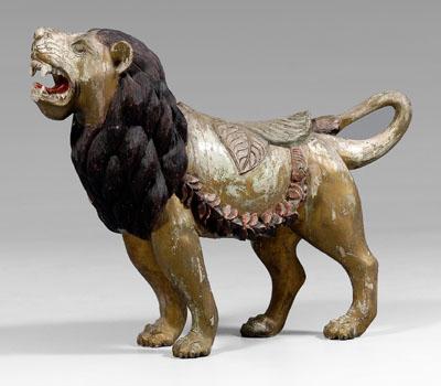 Carved and paint-decorated lion,