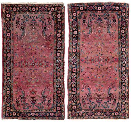 Pair Sarouk rugs: both with symmetrical