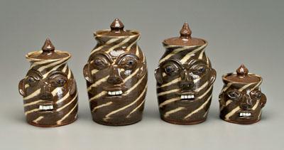 Four lidded stoneware face canisters  94d15