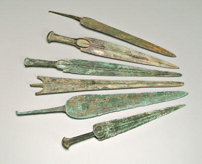 Six ancient bronze daggers or short