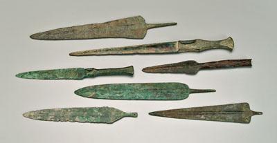 Seven ancient bronze daggers or