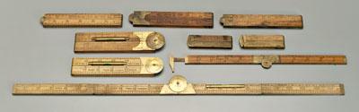 Nine brass-mounted folding rulers: