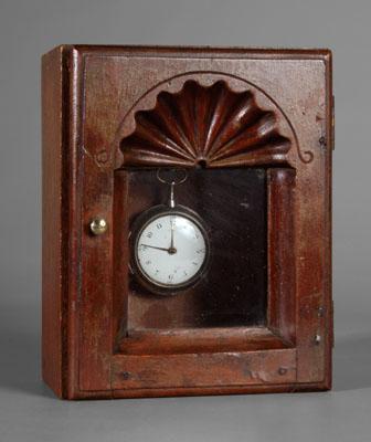 Important carved cherry watch hutch,