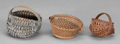 Three miniature baskets: two oak