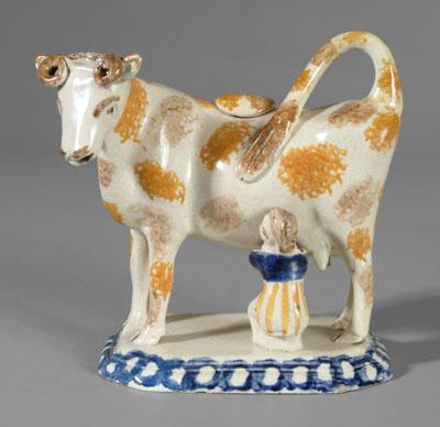 Pearlware cow creamer with lid, orange,