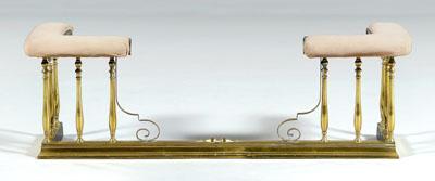 Brass and iron club fender, upholstered