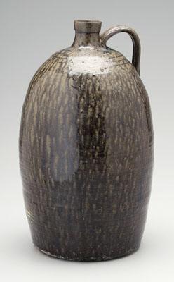 Stoneware jug, strap handle, mottled