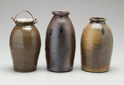 Three stoneware canning jars: one