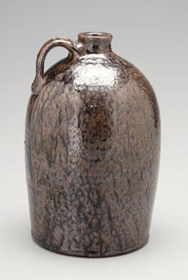 Stoneware jug, strap handle impressed