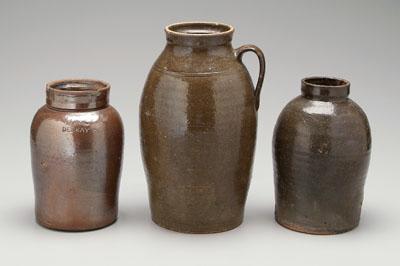 Three stoneware jars one with 95167