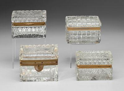Four rectangular cut glass boxes,