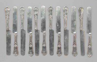 Set of 12 coin silver knives: shaped