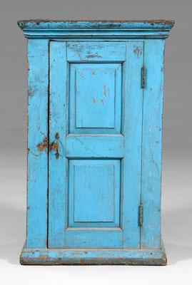 Blue-painted paneled cupboard,