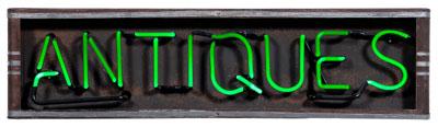 Neon Antiques sign, green lettering