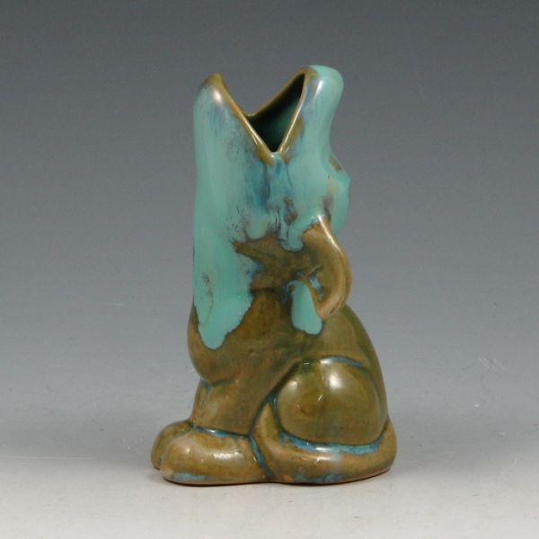 Shearwater howling dog figurine in flowing
